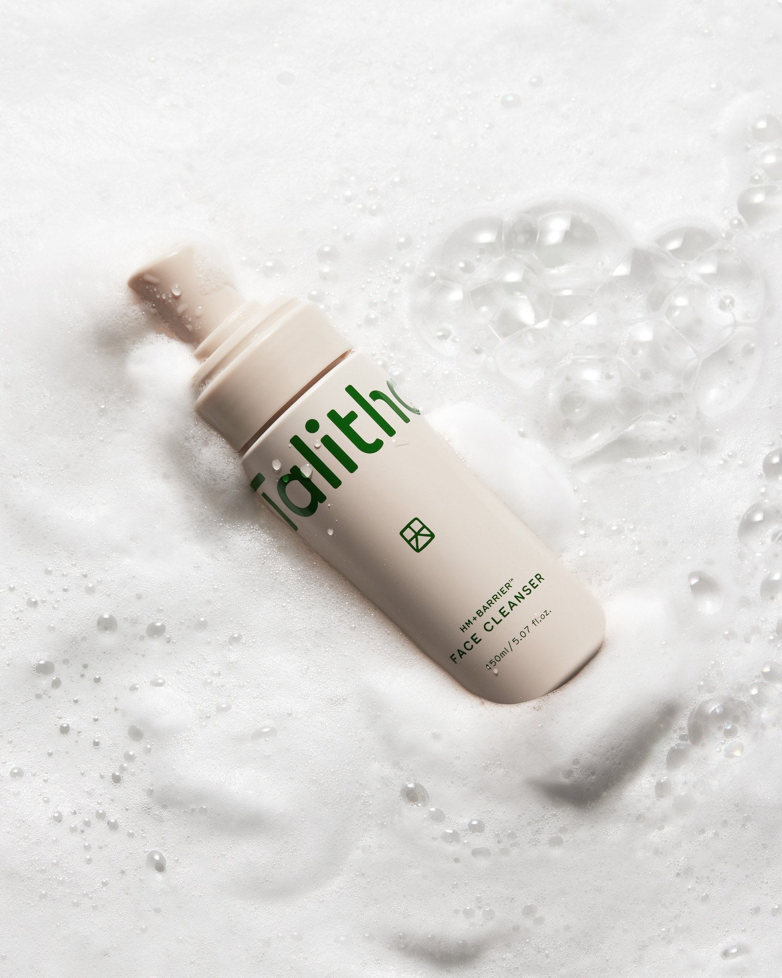HM+Barrier Face Cleanser lying in soft white foam
